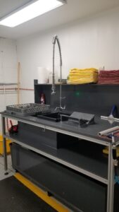 An MFI customer HZ-40 set up with Processing Table and Tank along with a Media Storage Rack.